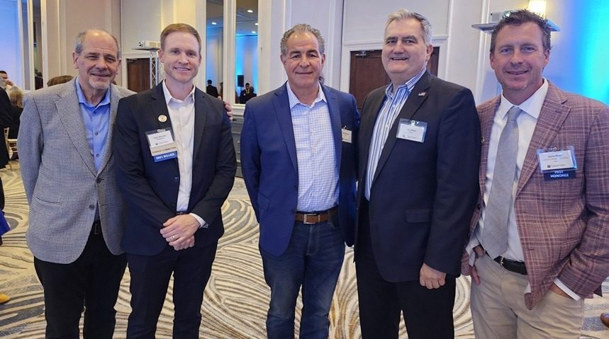 Michael Papadakis, left, Minhas; Ryan Mahoney, Andmore; and Frank Derasmo, Jim Ziozis, Linon and Jason Brian, all of Liberty Furniture.