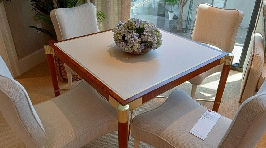 Sherrill Furniture offers the Mr. & Mrs. Howard Hither Game Table with walnut veneers and a leather top.